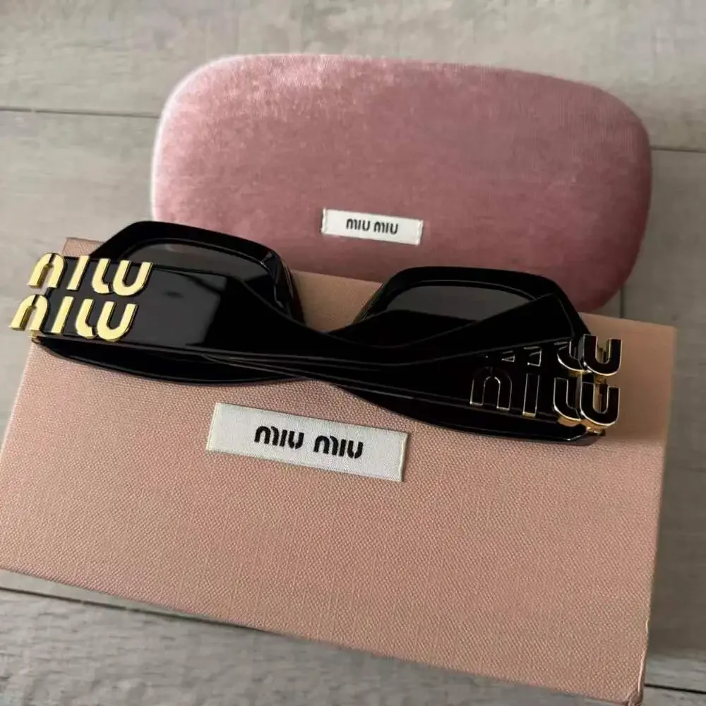 Miu Miu Glossy Black Cat Eye Acetate Sunglasses